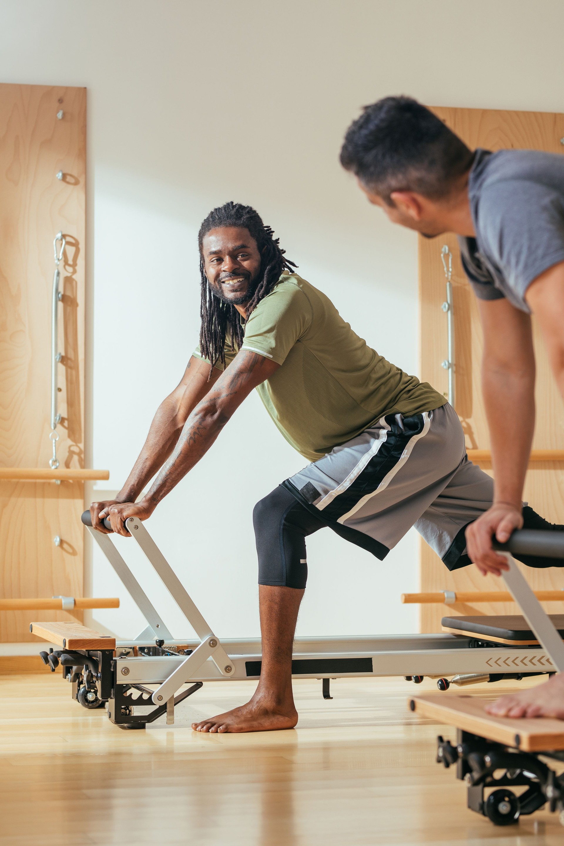Sportsmen Having Workout at Pilates Studio